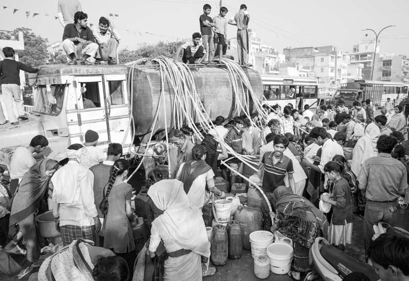 Urban Drinking Water Challenges - Struggle for collecting drinking water from a tanker in South-East district, National Capital Territory of Delhi